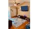 Bright living room featuring a ceiling fan, mounted TV, and a patterned area rug at 429 Stephanie Dr, Goose Creek, SC 29445
