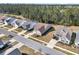 Aerial view of a residential neighborhood showcasing the arrangement of homes, streets, and green spaces at 458 Four Seasons Blvd, Summerville, SC 29486