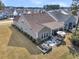 Aerial view of a home with a patio, outdoor seating, an enclosed porch, and a landscaped backyard at 458 Four Seasons Blvd, Summerville, SC 29486