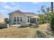 A backyard with a patio area, Adirondack chairs, outdoor seating, and an outdoor kitchen at 458 Four Seasons Blvd, Summerville, SC 29486