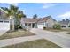 Beautiful one-story home features a 2-car garage, a cozy front porch, and mature landscaping at 458 Four Seasons Blvd, Summerville, SC 29486