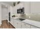 Close up of modern kitchen with white cabinets, granite countertops, and stainless steel appliances at 458 Four Seasons Blvd, Summerville, SC 29486