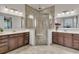 Elegant bathroom featuring a glass shower with a built-in seat and dual vanities at 458 Four Seasons Blvd, Summerville, SC 29486