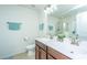 Bright bathroom featuring a double sink vanity with brushed nickel faucets and decorative accents at 458 Whispering Breeze Ln, Summerville, SC 29486