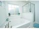 Bright bathroom featuring a large soaking tub and a glass enclosed shower at 458 Whispering Breeze Ln, Summerville, SC 29486