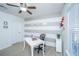 Study room with a white executive desk with chair and striped accent wall at 458 Whispering Breeze Ln, Summerville, SC 29486