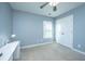 Bedroom with carpet, ceiling fan, and a modern white desk at 458 Whispering Breeze Ln, Summerville, SC 29486