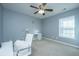 Bedroom with carpet, ceiling fan, a modern white chair, and a desk at 458 Whispering Breeze Ln, Summerville, SC 29486