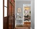 Entryway view featuring a wood door and an adjacent dining room with modern lighting at 49 Crosscreek Dr, Charleston, SC 29412