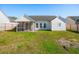 Grassy backyard featuring a screened-in porch and fencing at 5020 Holdsworth Dr, Summerville, SC 29485