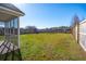 Spacious backyard featuring a screened-in porch and a play set at 5020 Holdsworth Dr, Summerville, SC 29485