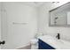 Bright bathroom featuring a large mirror, white sink, and tiled shower at 5020 Holdsworth Dr, Summerville, SC 29485