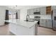 Bright kitchen with stainless steel appliances, a center island, and gray cabinets at 5020 Holdsworth Dr, Summerville, SC 29485