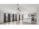 Spacious living room featuring modern flooring, a ceiling fan, and ample natural light at 5020 Holdsworth Dr, Summerville, SC 29485
