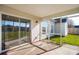 Covered screened-in porch overlooking a spacious backyard at 5020 Holdsworth Dr, Summerville, SC 29485