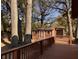 Back deck with a view of the storage shed in the backyard and surrounding trees at 5310 Edith St, North Charleston, SC 29418