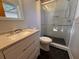 Bathroom featuring updated vanity, sink, toilet, a walk-in shower, and modern black and white tile at 5310 Edith St, North Charleston, SC 29418