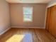 Bedroom features hardwood floors, gray walls, a window and closet at 5310 Edith St, North Charleston, SC 29418