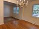 Bright dining room with hardwood floors, chandelier, and natural light from surrounding windows at 5310 Edith St, North Charleston, SC 29418