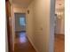 Light and bright hallway featuring hardwood floors and views into adjoining rooms at 5310 Edith St, North Charleston, SC 29418