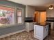 Eat in kitchen with stainless appliances, a kitchen island and a backyard view at 5310 Edith St, North Charleston, SC 29418