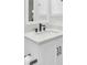 Bathroom features a modern vanity with marble countertop, dark fixtures, and tiled floors at 60 Fairway Dunes Ln, Isle of Palms, SC 29451