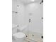Modern bathroom featuring a glass shower with a built-in seat and white tile at 60 Fairway Dunes Ln, Isle of Palms, SC 29451