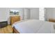 Relaxing bedroom features hardwood floors, TV and ensuite bathroom at 60 Fairway Dunes Ln, Isle of Palms, SC 29451