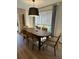 Bright dining room with a modern table, stylish chairs, and a light-filled window view and modern decor at 60 Fairway Dunes Ln, Isle of Palms, SC 29451