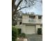 Two-story home with a balcony and garage featuring well-maintained landscaping and natural light at 60 Fairway Dunes Ln, Isle of Palms, SC 29451