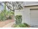 Exterior of a home with a garage and mature landscaping at 60 Fairway Dunes Ln, Isle of Palms, SC 29451