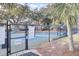 Well-maintained pickleball court with posted rules and beautiful landscaping at 60 Fairway Dunes Ln, Isle of Palms, SC 29451