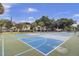 Enjoy a game of pickleball on one of the community's multiple courts, surrounded by lush landscaping at 60 Fairway Dunes Ln, Isle of Palms, SC 29451