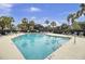 Community pool featuring clear blue water, a spacious deck and plenty of lounge chairs at 60 Fairway Dunes Ln, Isle of Palms, SC 29451