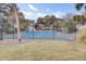 Tennis court in a fenced recreational area with beautiful neighborhood backdrop at 60 Fairway Dunes Ln, Isle of Palms, SC 29451