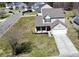 Aerial view of a charming two-story home with a gray roof and a long driveway at 629 English Oak Cir, Moncks Corner, SC 29461