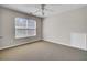 Bedroom featuring neutral paint, carpet, ceiling fan, and large window at 629 English Oak Cir, Moncks Corner, SC 29461