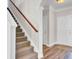 Inviting entryway features hardwood floors, staircase, and white trim at 629 English Oak Cir, Moncks Corner, SC 29461