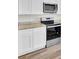 Modern kitchen design with white cabinetry, stainless steel appliances and granite counters at 629 English Oak Cir, Moncks Corner, SC 29461