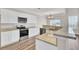 Bright kitchen with stainless appliances, white cabinetry, and breakfast bar seating at 629 English Oak Cir, Moncks Corner, SC 29461