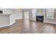 Spacious living room features hardwood floors, a cozy fireplace, and lots of natural light at 629 English Oak Cir, Moncks Corner, SC 29461