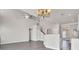 Open concept living room with wood floors, chandelier lighting and an open stairway at 629 English Oak Cir, Moncks Corner, SC 29461