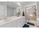 Bathroom with double sink vanity, tile flooring, and a glass enclosed shower stall at 68 Red Bluff St, Summerville, SC 29483