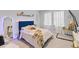 Bright bedroom features plush carpet, a striking blue headboard, and a unique hanging swing chair at 68 Red Bluff St, Summerville, SC 29483