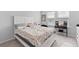 Bedroom with a large bed, vanity, and bright natural light at 68 Red Bluff St, Summerville, SC 29483