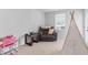 Cozy bedroom featuring a plush recliner and a small play area at 68 Red Bluff St, Summerville, SC 29483