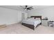 Spacious bedroom with neutral carpet, a fan, and a double door closet for ample storage at 68 Red Bluff St, Summerville, SC 29483