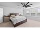 This bedroom features carpet, large windows with blinds, and a ceiling fan for comfort at 68 Red Bluff St, Summerville, SC 29483