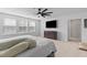 Relaxing bedroom featuring cozy bedding, a large window for natural light, and ceiling fan at 68 Red Bluff St, Summerville, SC 29483