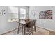 Charming dining area with natural light, a wooden table set and decorative accents at 68 Red Bluff St, Summerville, SC 29483